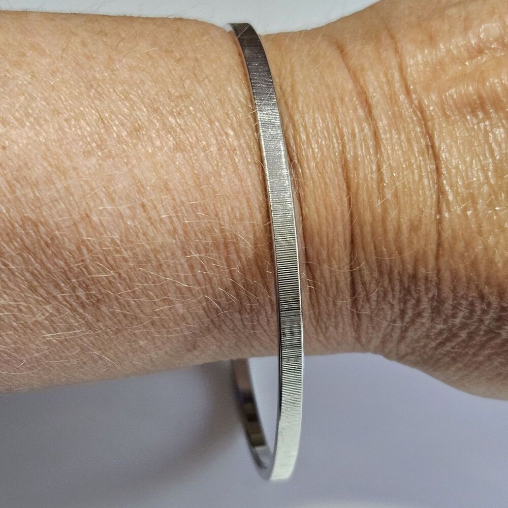 Monet Silver Tone Etched Bangle Bracelet 8.25"